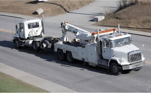 Heavy truck being towed