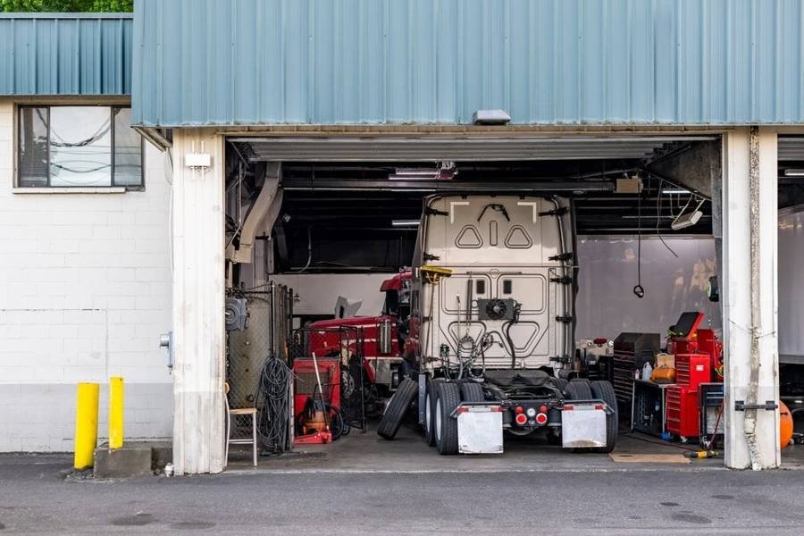 Big rig parked in a truck repair shop