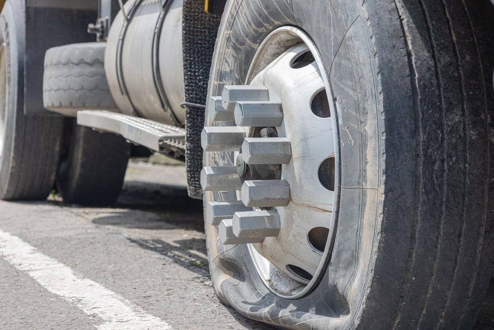 Truck tire repair on the highway for a transport truck